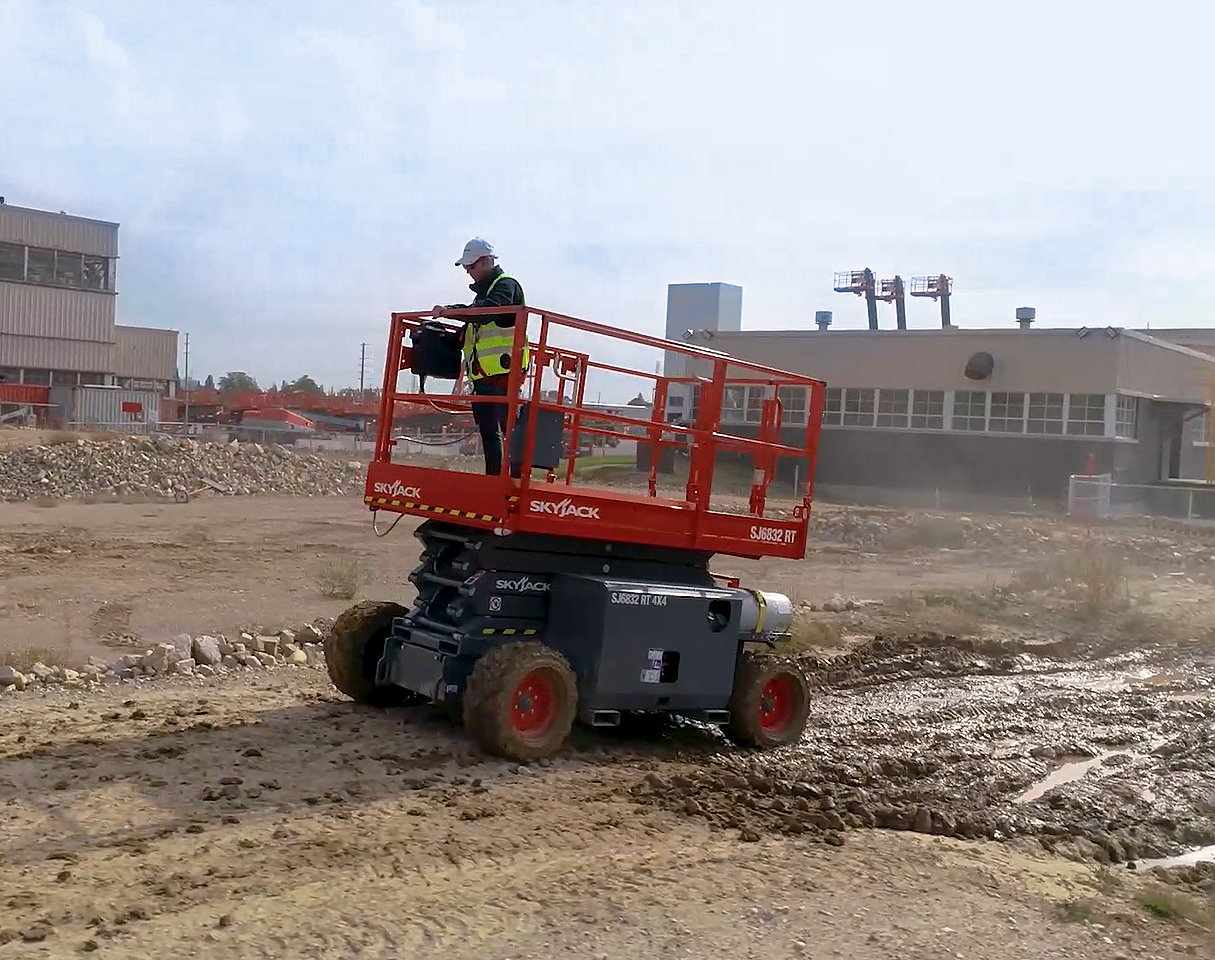 SJ6832 RT machine traversing sand and mud trail